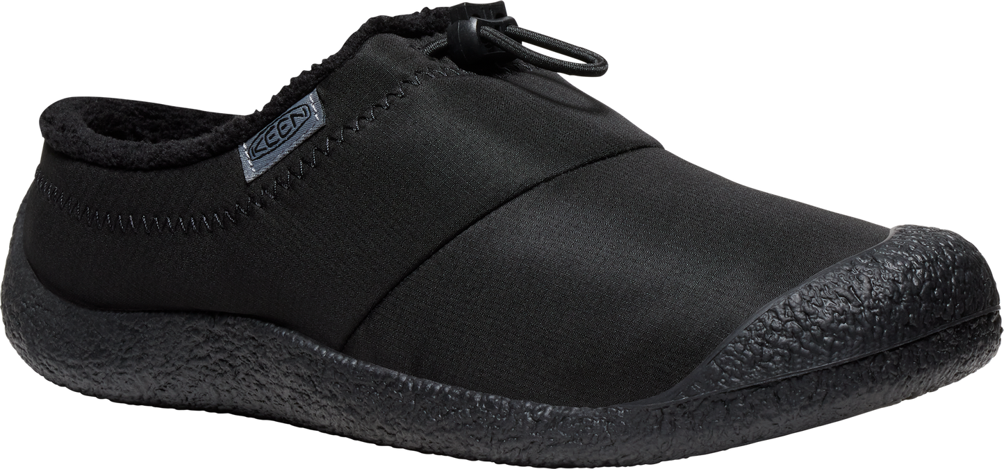 A black slip-on shoe with a rounded toe.