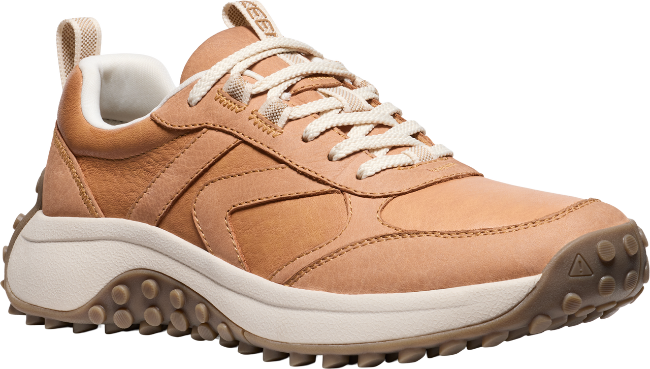 Tan leather low-top sneaker with white laces and a thick white midsole, and a brown lug outsole.