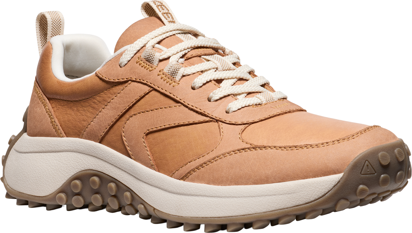 Tan leather low-top sneaker with white laces and a thick white midsole, and a brown lug outsole.