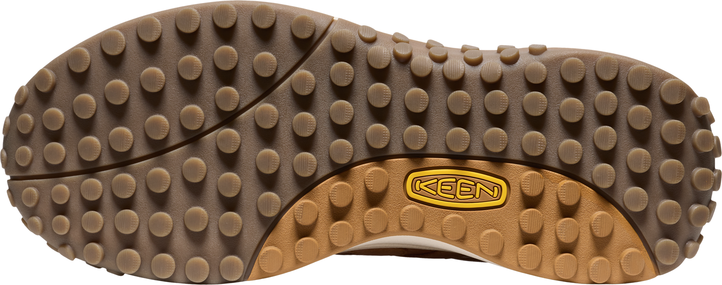 Shoe sole with a repeating dot pattern and a logo.