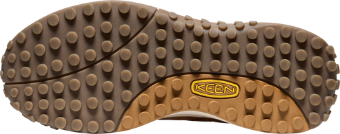 Shoe sole with a repeating dot pattern and a logo.