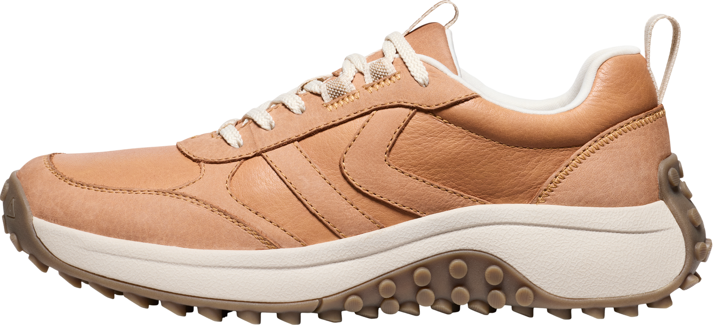 A tan leather sneaker with white laces and a thick white sole.