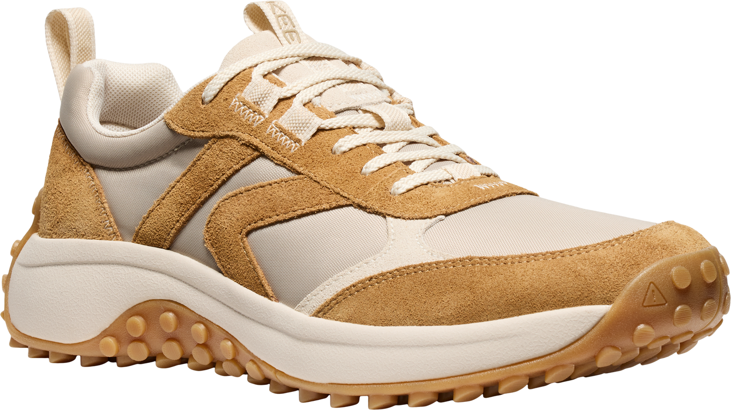 Tan and off-white low profile sneaker with lug sole.