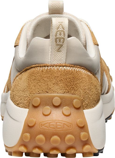 Rear view of a beige, cream and tan low top athletic shoe with KEEN branding visible.