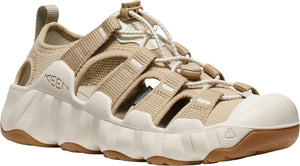 Beige sandal with white sole, beige straps, and Keen logo.
