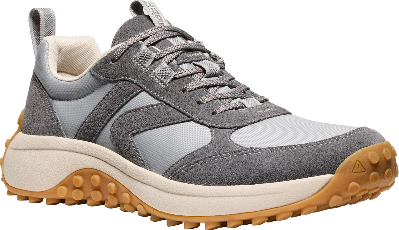 A gray casual sneaker with a tan lug sole and light gray panels.
