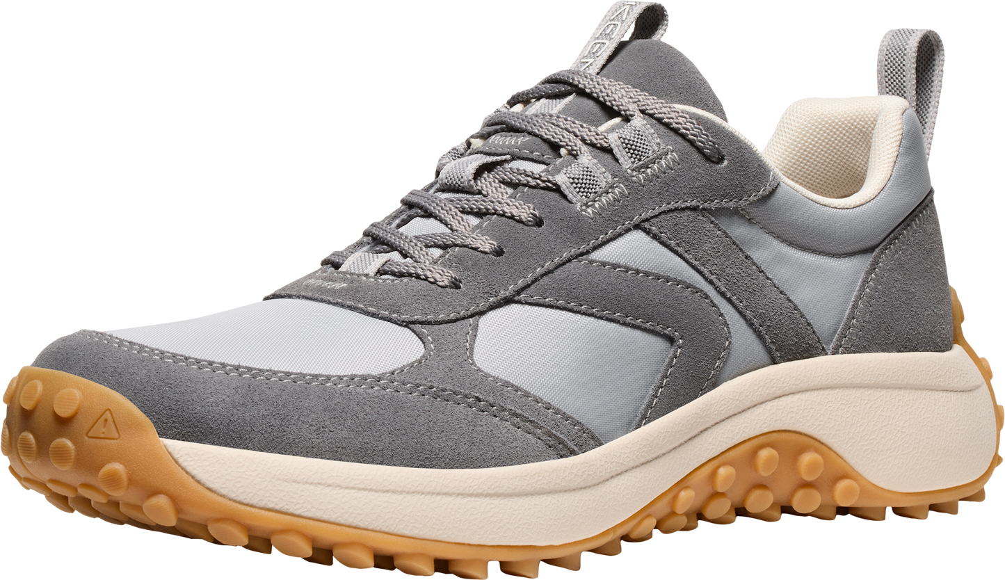 Gray sneaker with suede details, lace-up closure, off-white midsole, and lugged rubber outsole.