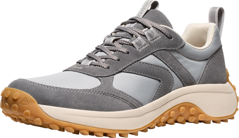 Gray sneaker with suede details, lace-up closure, off-white midsole, and lugged rubber outsole.