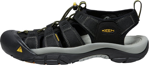 A black sandal with multiple straps and the text 'KEEN' visible.