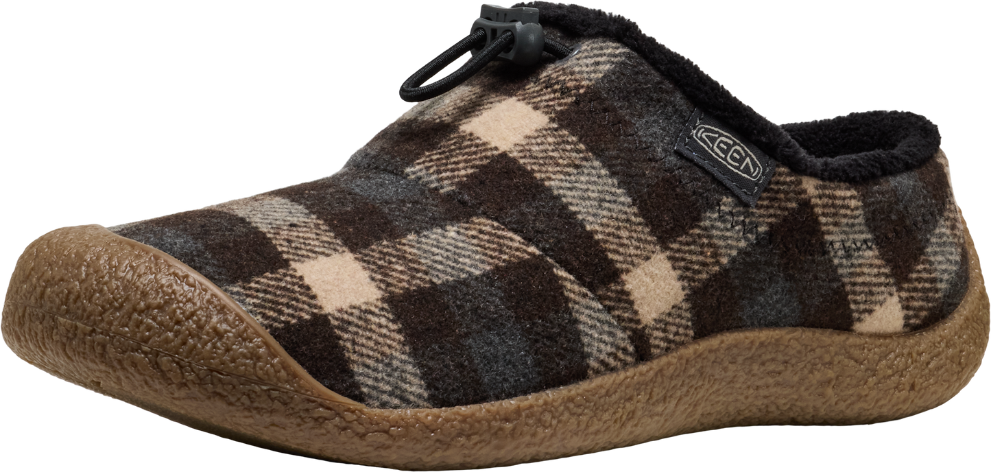 A plaid slipper with a tan toe and sole.