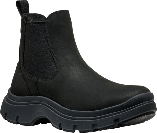 A black Chelsea-style boot with a thick, lugged sole and elastic side panels.