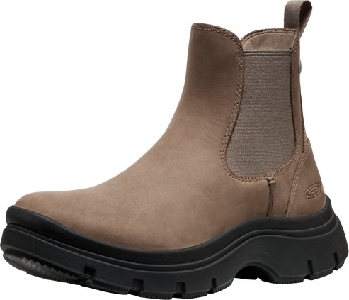 Taupe Chelsea boot with black lug sole.