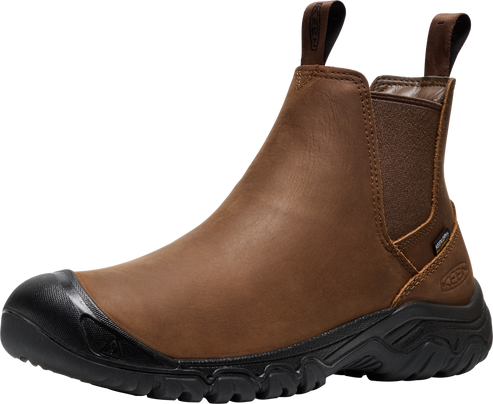 Brown leather pull-on boot with black toe cap and treaded sole.