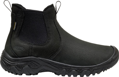 A black leather slip-on ankle boot with a rugged, thick rubber tread sole, an elastic side panel, and dual pull tabs at the top.