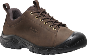 A brown leather shoe with black sole and eyelets.
