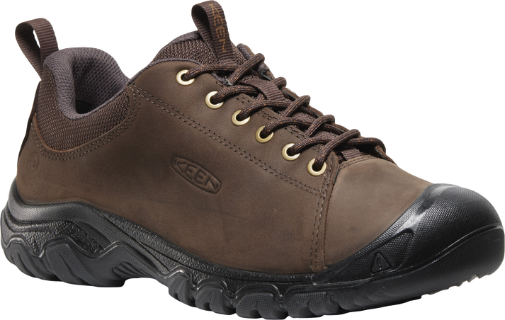 A brown leather shoe with black sole and eyelets.