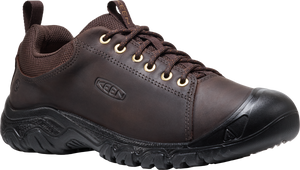 Low-cut brown leather shoe with black rubber toe and sole, laced with brown laces through gold eyelets.