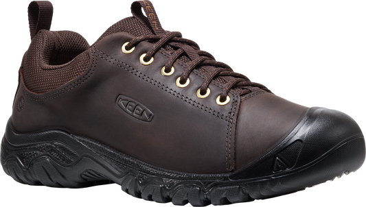 Low-cut brown leather shoe with black rubber toe and sole, laced with brown laces through gold eyelets.