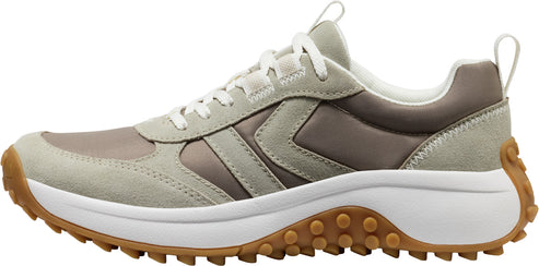 A sneaker with a beige, gray, and brown upper, white midsole, and brown lug outsole.