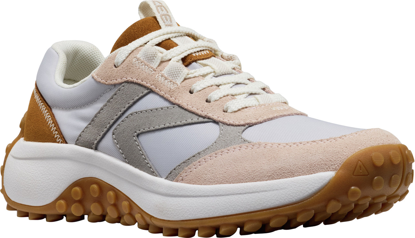 A white sneaker with light brown and gray accents, featuring a thick white sole and a brown tread.