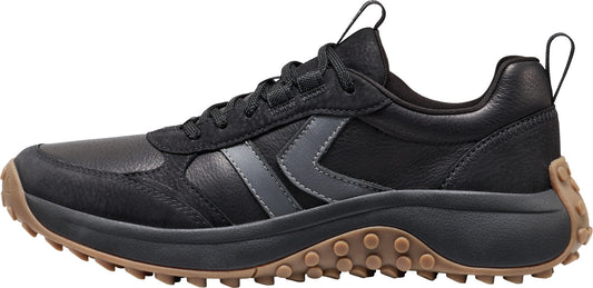 A black sneaker with a brown sole.