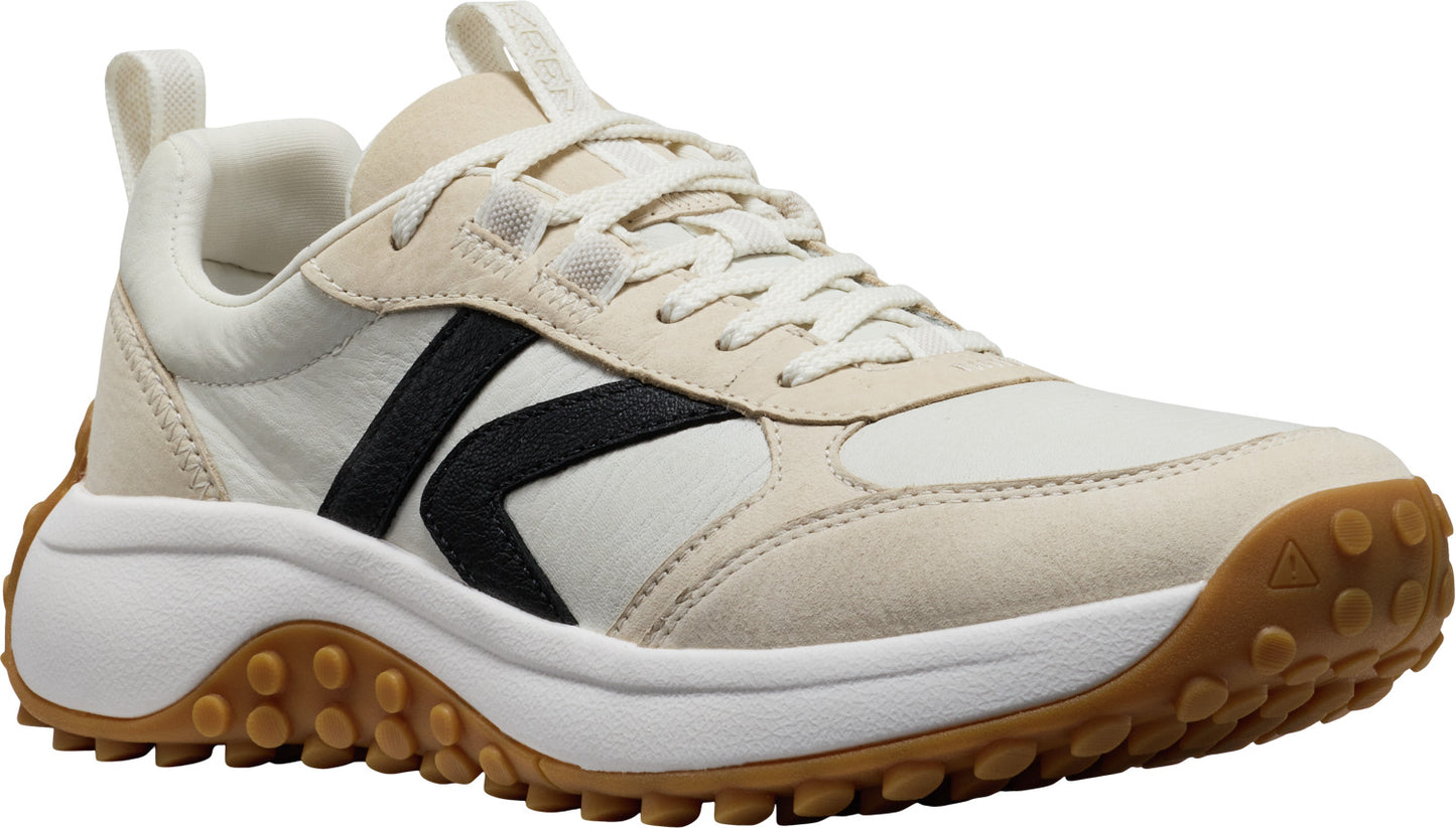 Beige athletic shoe with black stripe, white laces, and brown tread.
