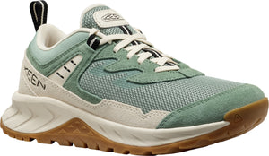 A low cut hiking shoe featuring a mesh upper with suede accents, a thick white midsole, and a brown lugged outsole.