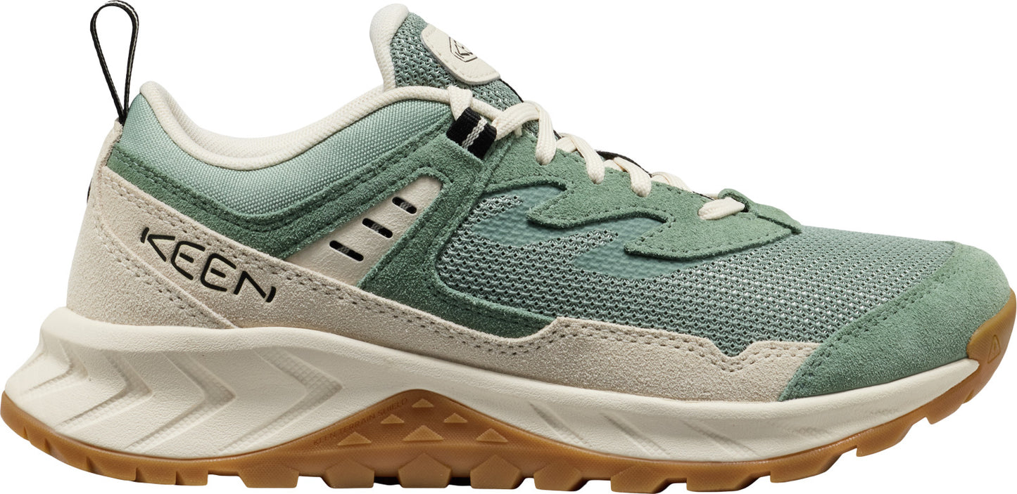 A low-profile shoe with a light green and beige upper and a brown sole.