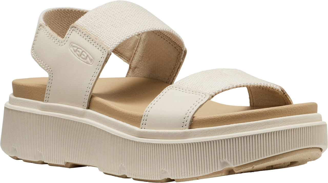 Platform sandal with beige leather straps.