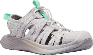 A light grey sandal with openwork and a green drawstring closure.