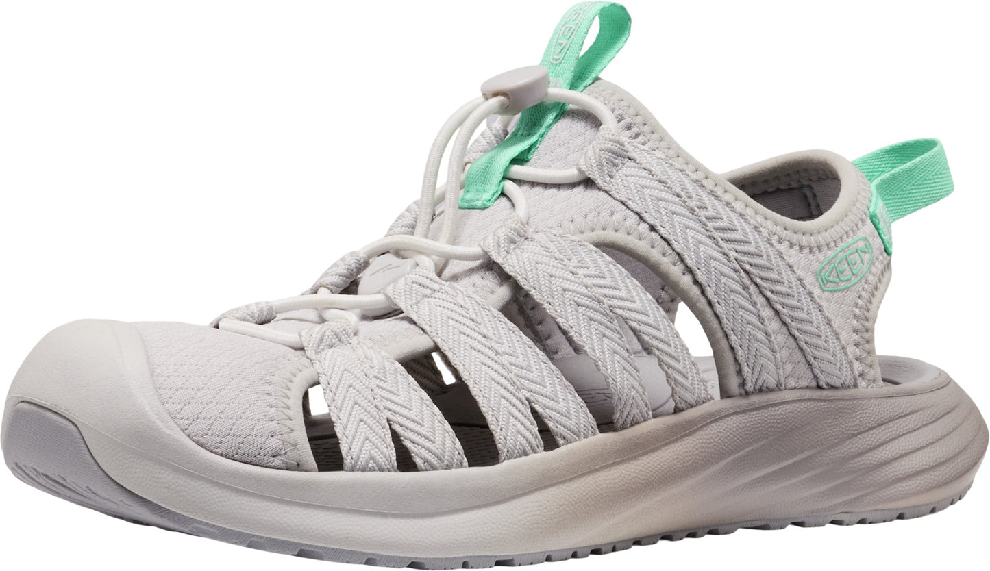 A gray, open-toed sandal with interwoven straps and mint green accents on the heel and adjustable front.
