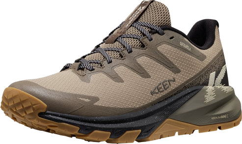 Tan running shoe with brown sole and laces.