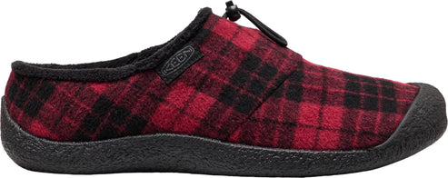 A slip-on shoe with a red and black plaid wool-like upper, a fuzzy black inner lining, and a black textured rubber outsole, featuring a small black bungee cord closure at the instep and a small tag with the word KEEN.
