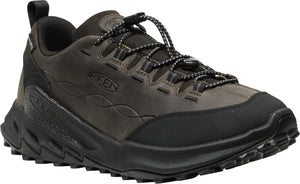 A dark gray KEEN low-top sneaker featuring a leather upper with a wavy embossed pattern, a black rubber toe cap, a sturdy lugged black outsole, and a quick-lace bungee cord closure system.