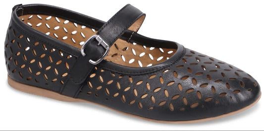 A black Mary Jane shoe with floral cutouts and a buckled strap.
