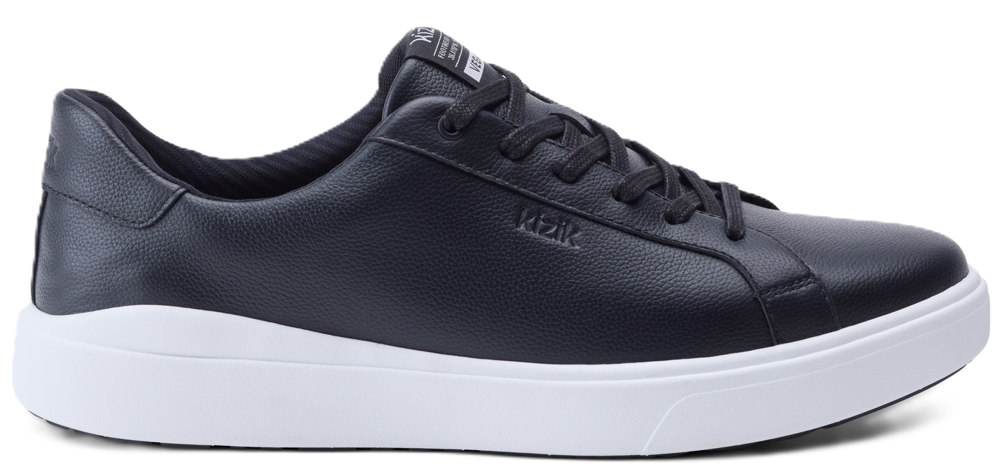 A navy blue leather sneaker with white sole.