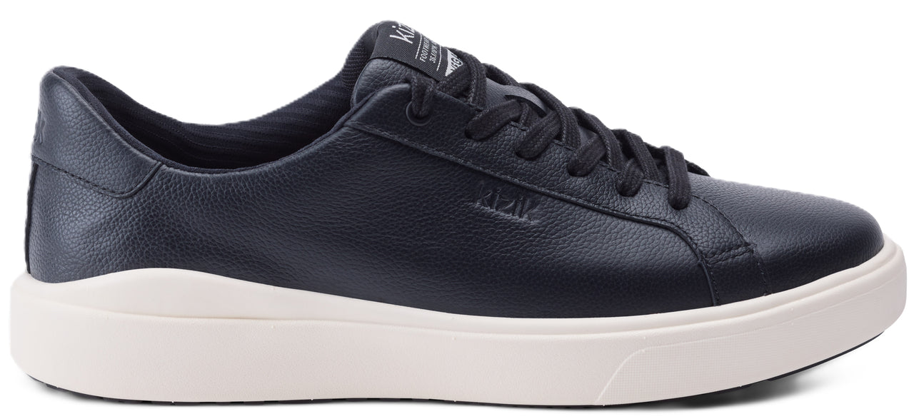 Low-top navy sneaker with a white sole.