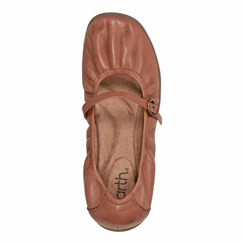 Top-down view of a light brown leather Mary Jane shoe with a buckle.