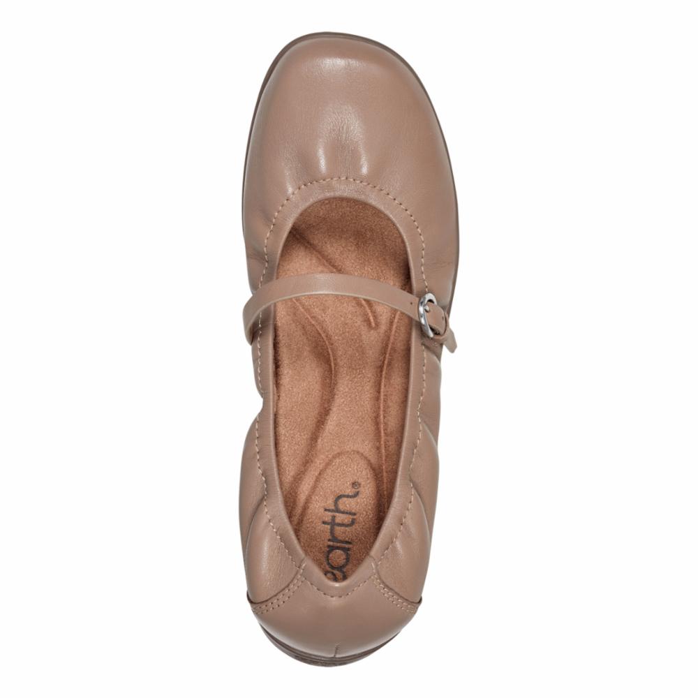 Top-down view of a leather ballet flat with a buckle strap.