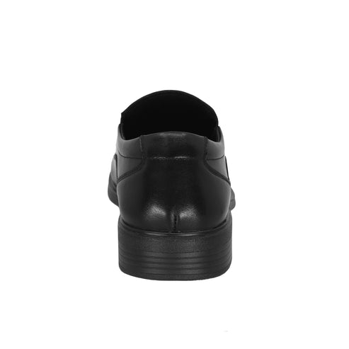 Black leather dress shoe, back view.