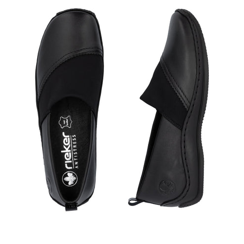 Two identical black leather flats viewed from above and side featuring a thick, black elastic panel at the instep, and a Rieker Antistress insole.