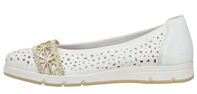 A white perforated slip-on shoe with straw-colored floral accent.