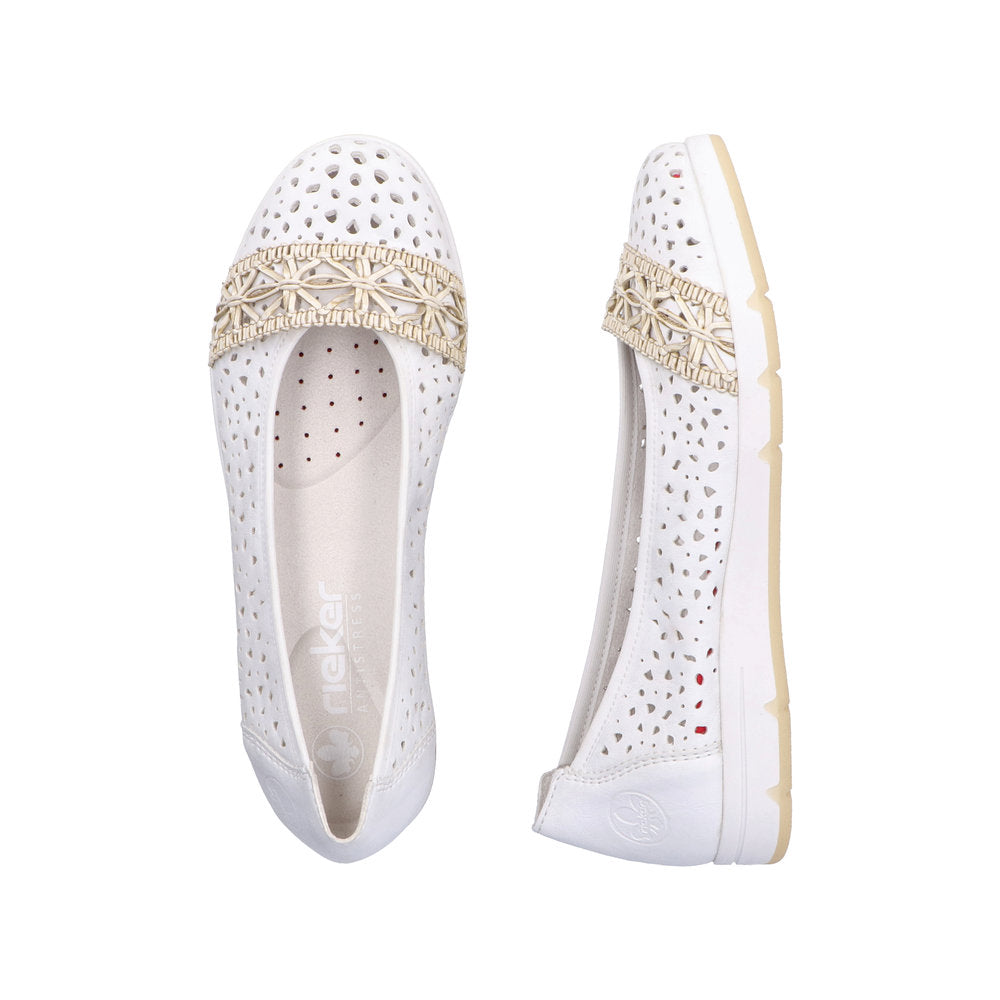 Two white flat shoes with decorative gold band.