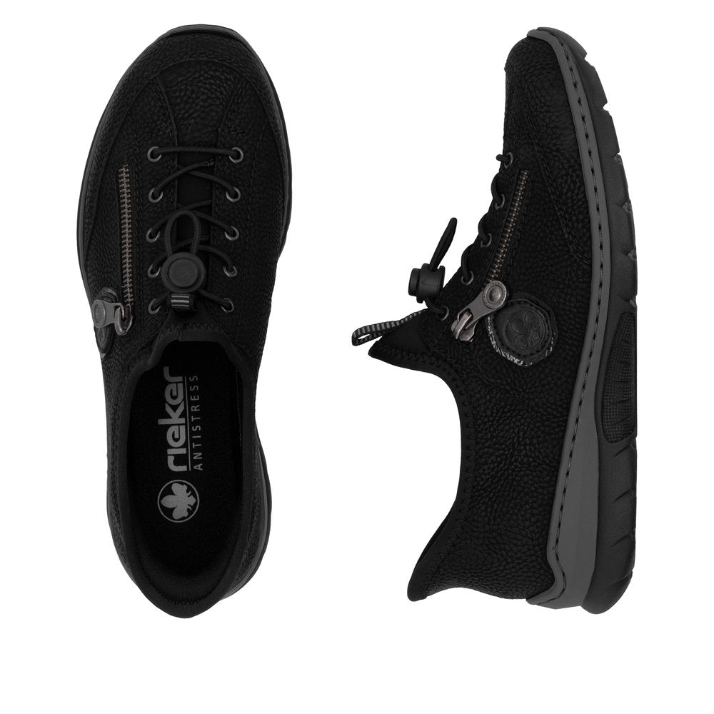 Two black sneakers with laces and zipper detail. One is facing forward and the other is at an angle.