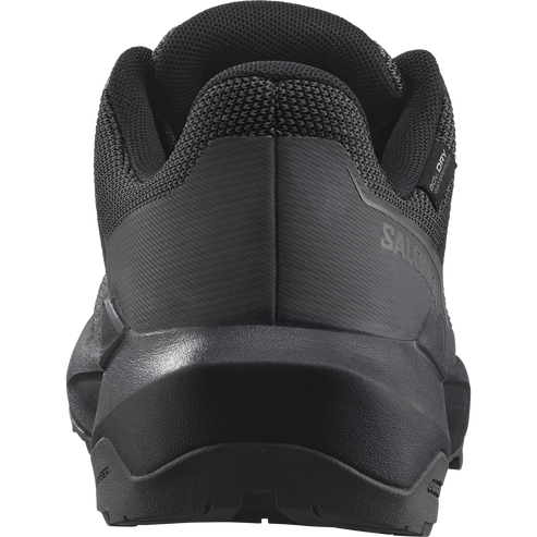 Back view of a dark gray athletic shoe.
