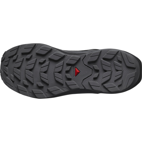 Dark grey shoe sole with a red triangle logo in the center.