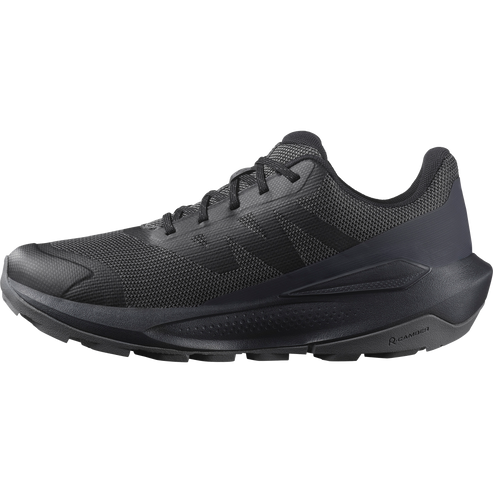 A dark gray running shoe with a mesh upper, a cushioned midsole, and a lugged outsole.