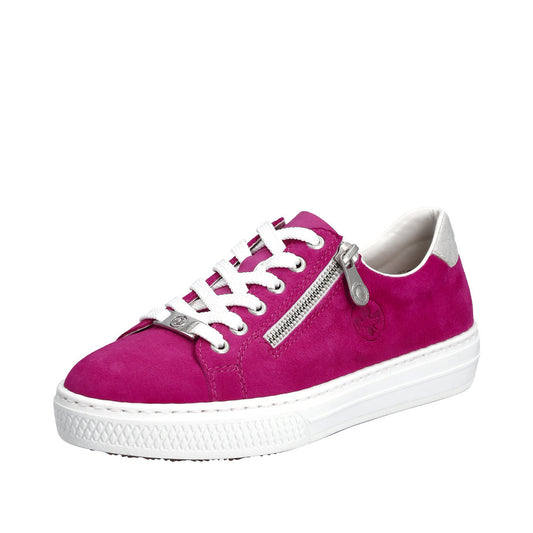 A pink suede sneaker with a white sole, white laces, and a silver zipper on the side.