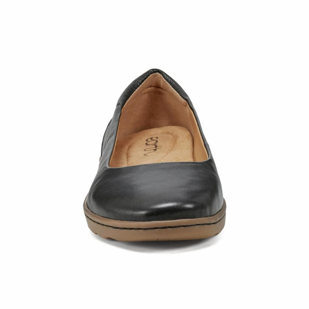 A black leather ballet flat shoe with a tan-colored insole and outsole.