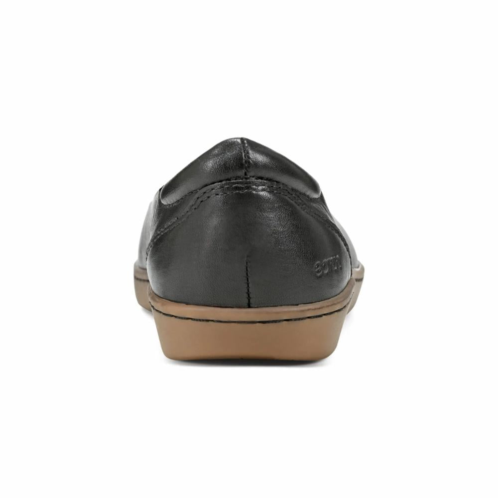 Rear view of a black leather slip-on shoe with a brown sole.